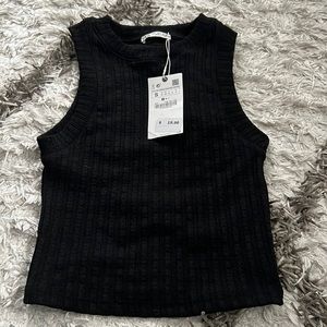 New Zara top that has never been worn before. It is a high neck black tank.